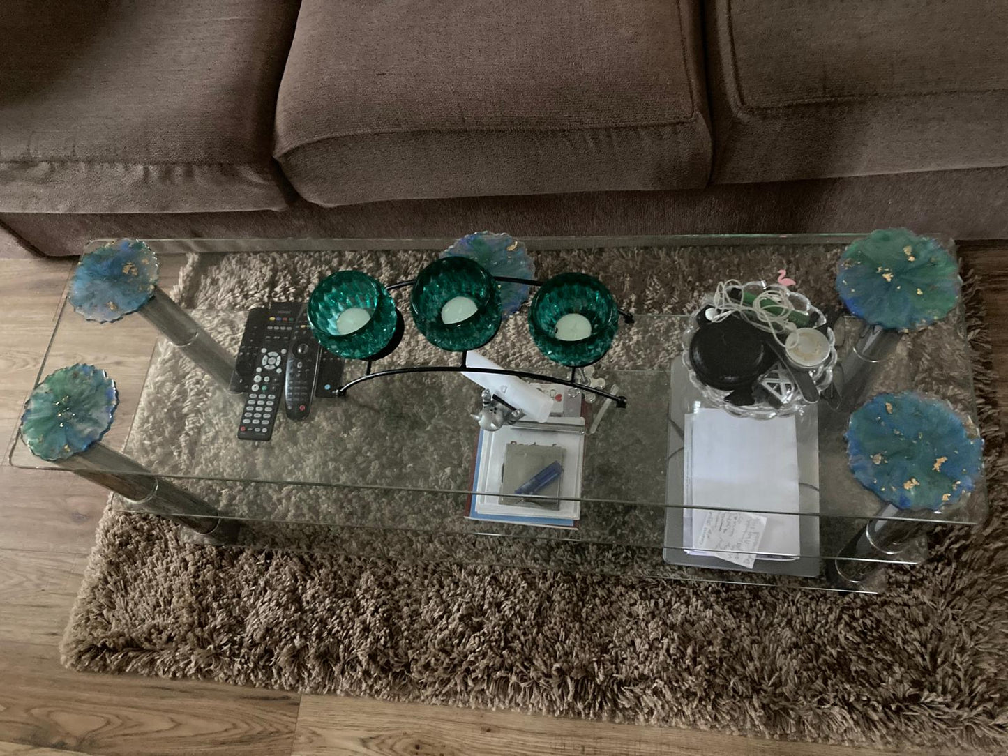 Handmade resin coasters blue/green pattern on a glass coffee table