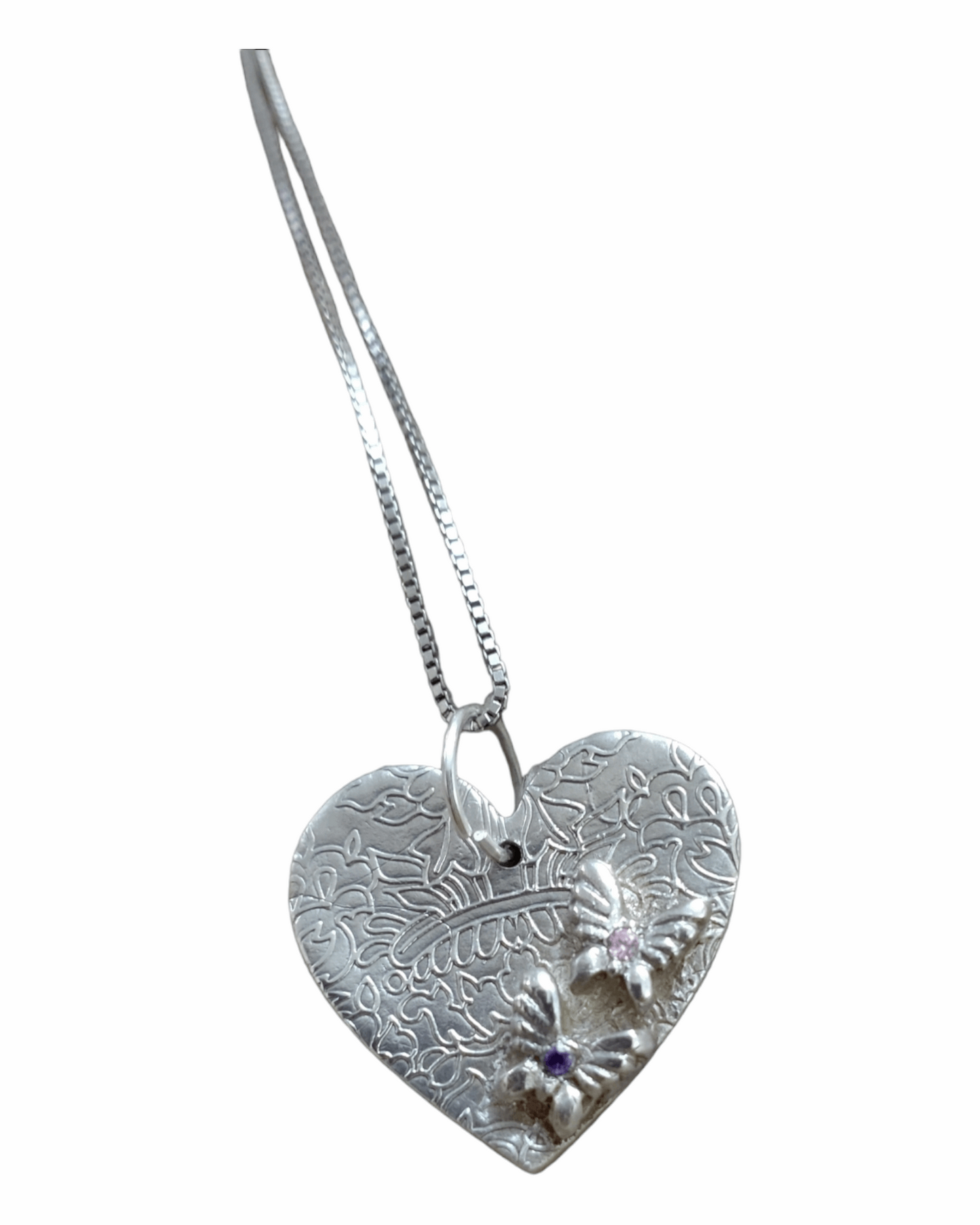 Handmade fine silver embossed heart shaped pendant with butterflies set with cubic zirconia stones